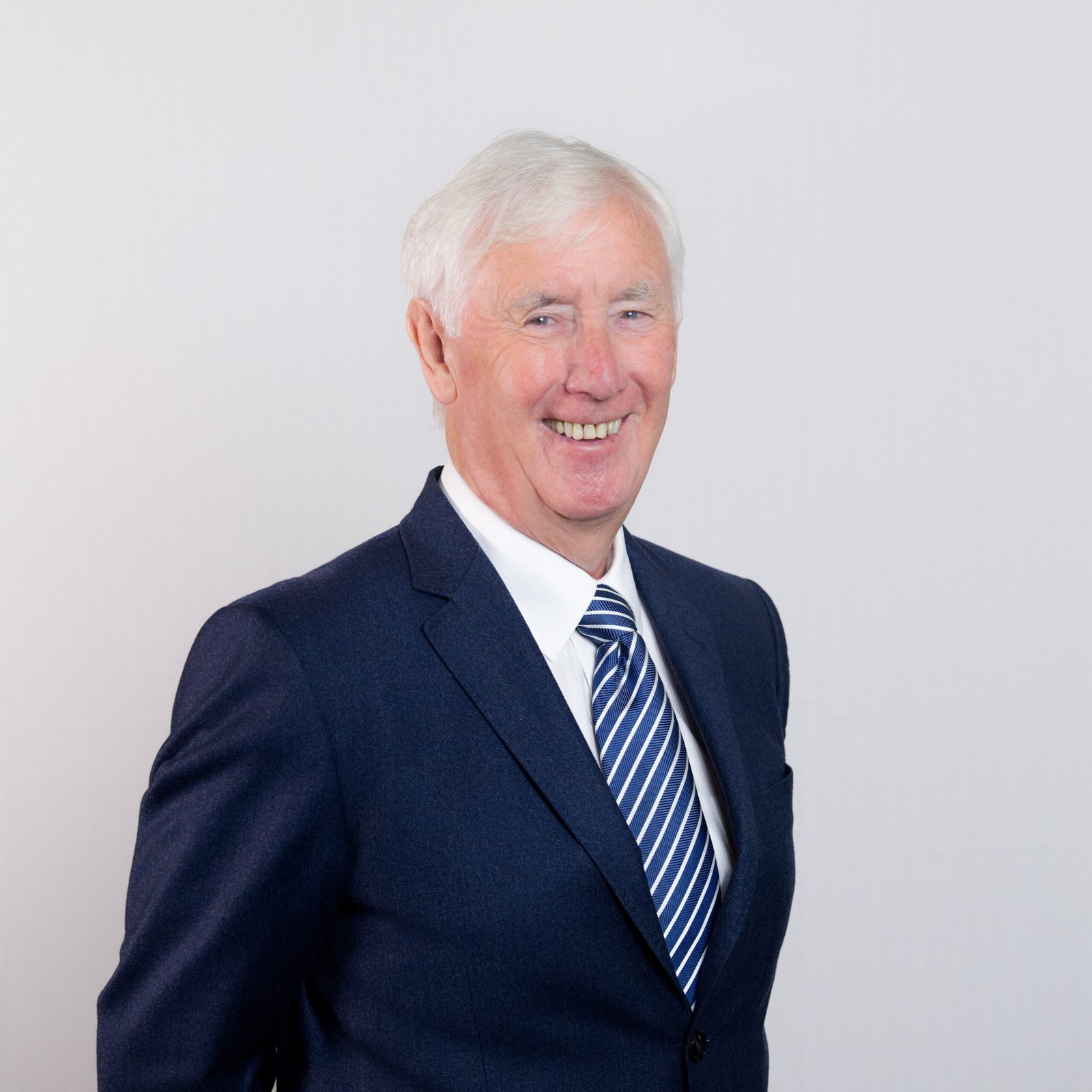Formal portrait of Les Walton CBE